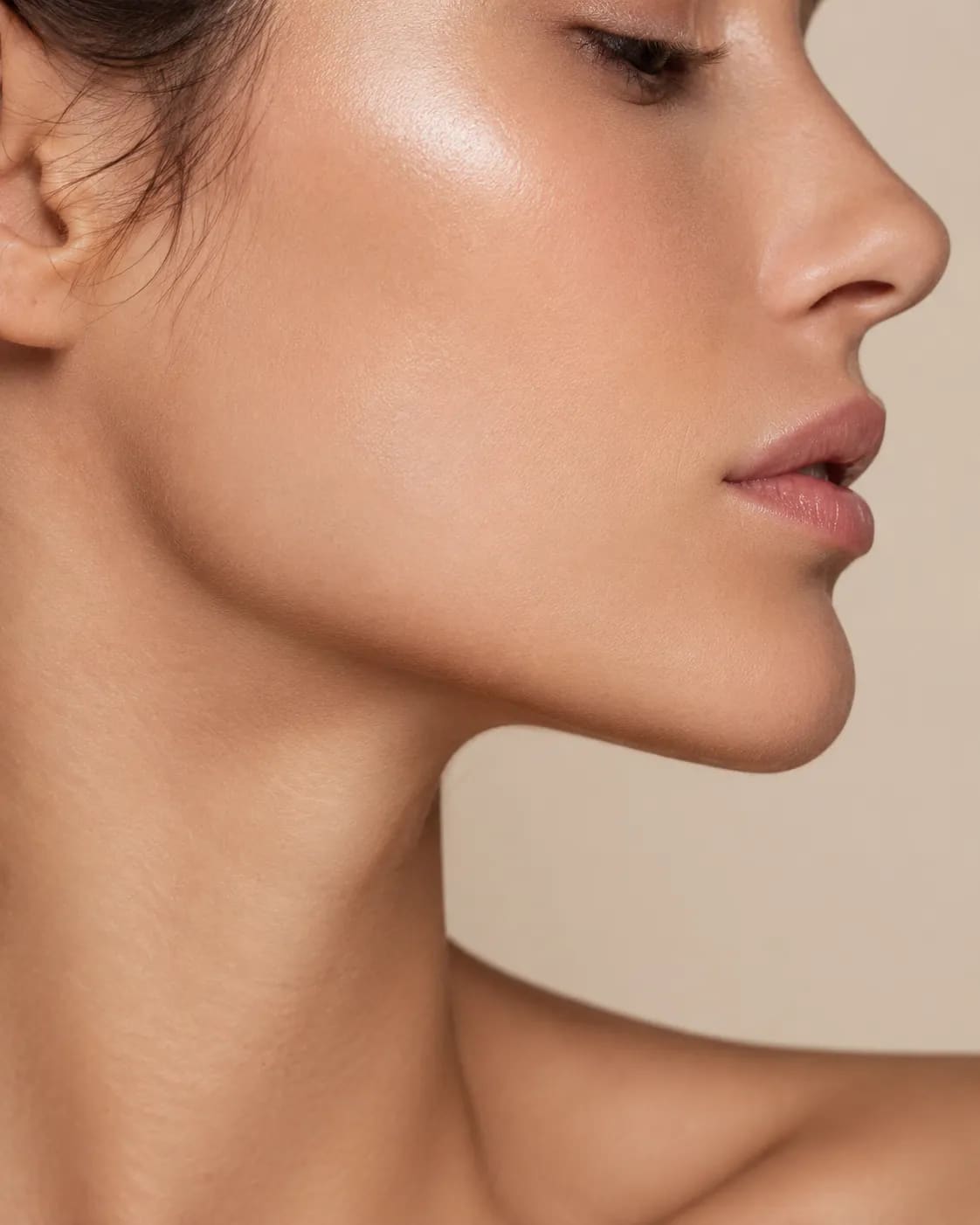 Elegant profile close-up showing refined jawline and skin texture